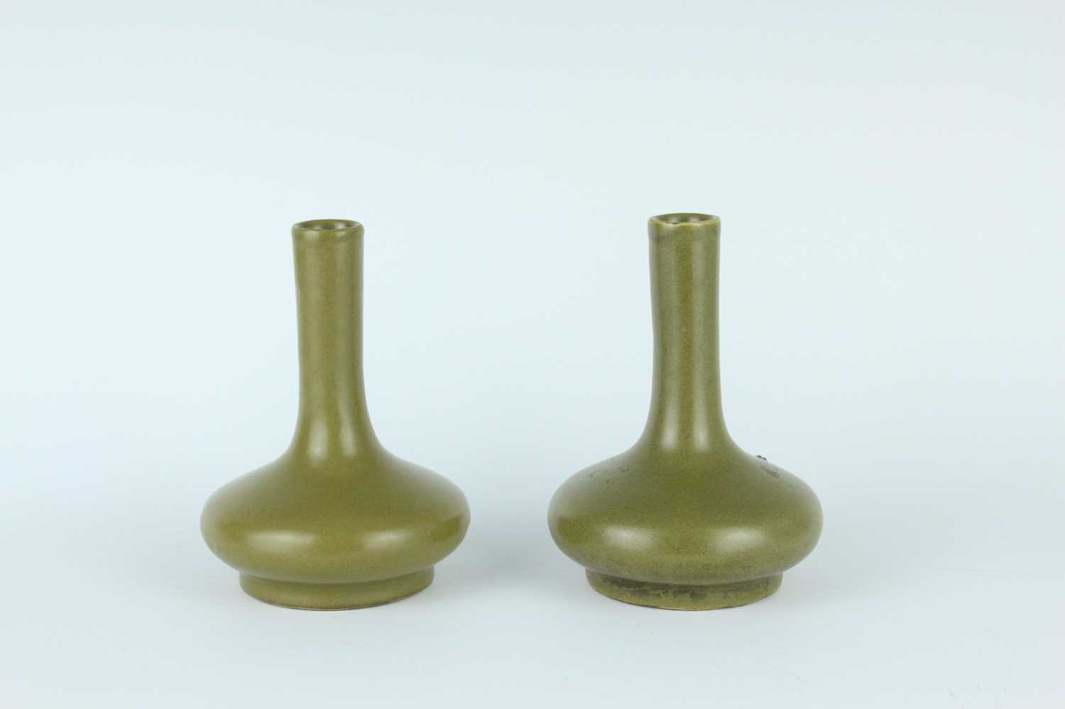 Lot 80 - A pair of Chinese teadust-glazed bottle vases,...