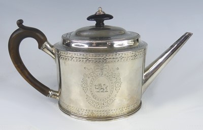 Lot 2245 - A George III silver teapot, of oval form with...