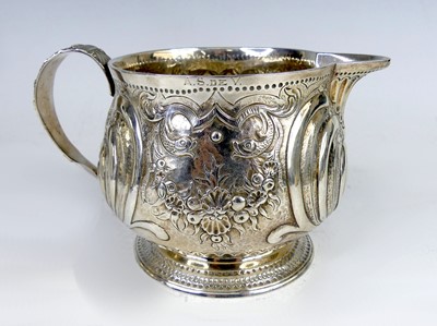Lot 2120 - A George III silver footed cream jug, having...