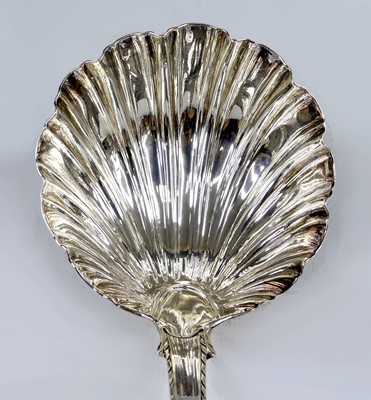 Lot 2099 - A George III silver soup ladle, in the Feather-...