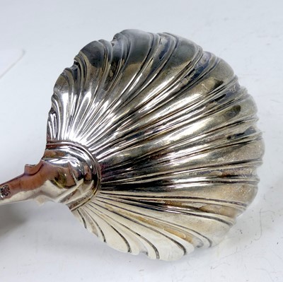 Lot 2099 - A George III silver soup ladle, in the Feather-...