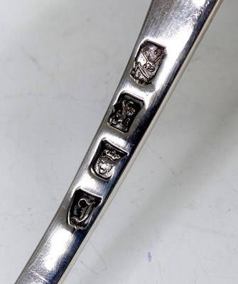 Lot 2099 - A George III silver soup ladle, in the Feather-...