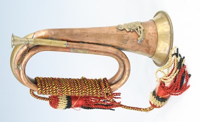 Lot 707 - A copper and brass bugle with applied badge...