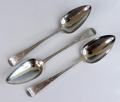 Lot 2138 - A set of three bright cut engraved tablespoons,...