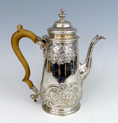 Lot 2125 - A George II silver coffee pot, having all-over...