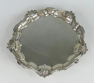 Lot 2109 - A George II silver salver, having scroll cast...