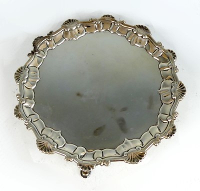 Lot 2226 - A George II silver card waiter, having shell...