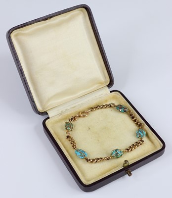 Lot 2699 - A 9ct gold curblink bracelet alternating with...