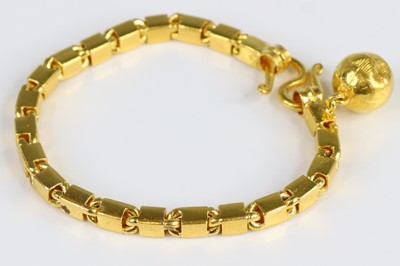 Lot A yellow metal rectangular link bracelet, with...