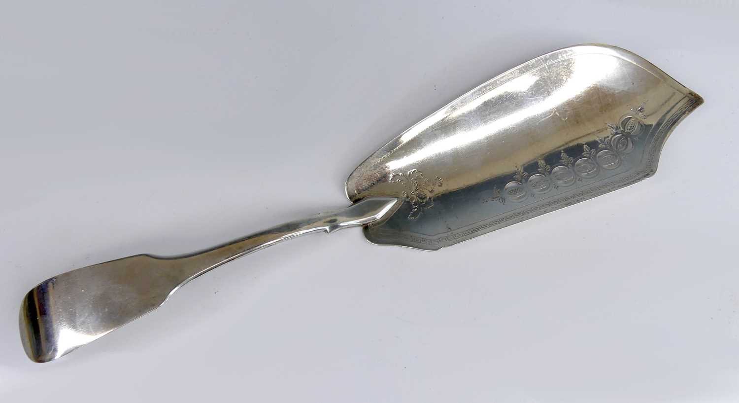 Lot 2084 - A George III silver fish slice, in the Fiddle...