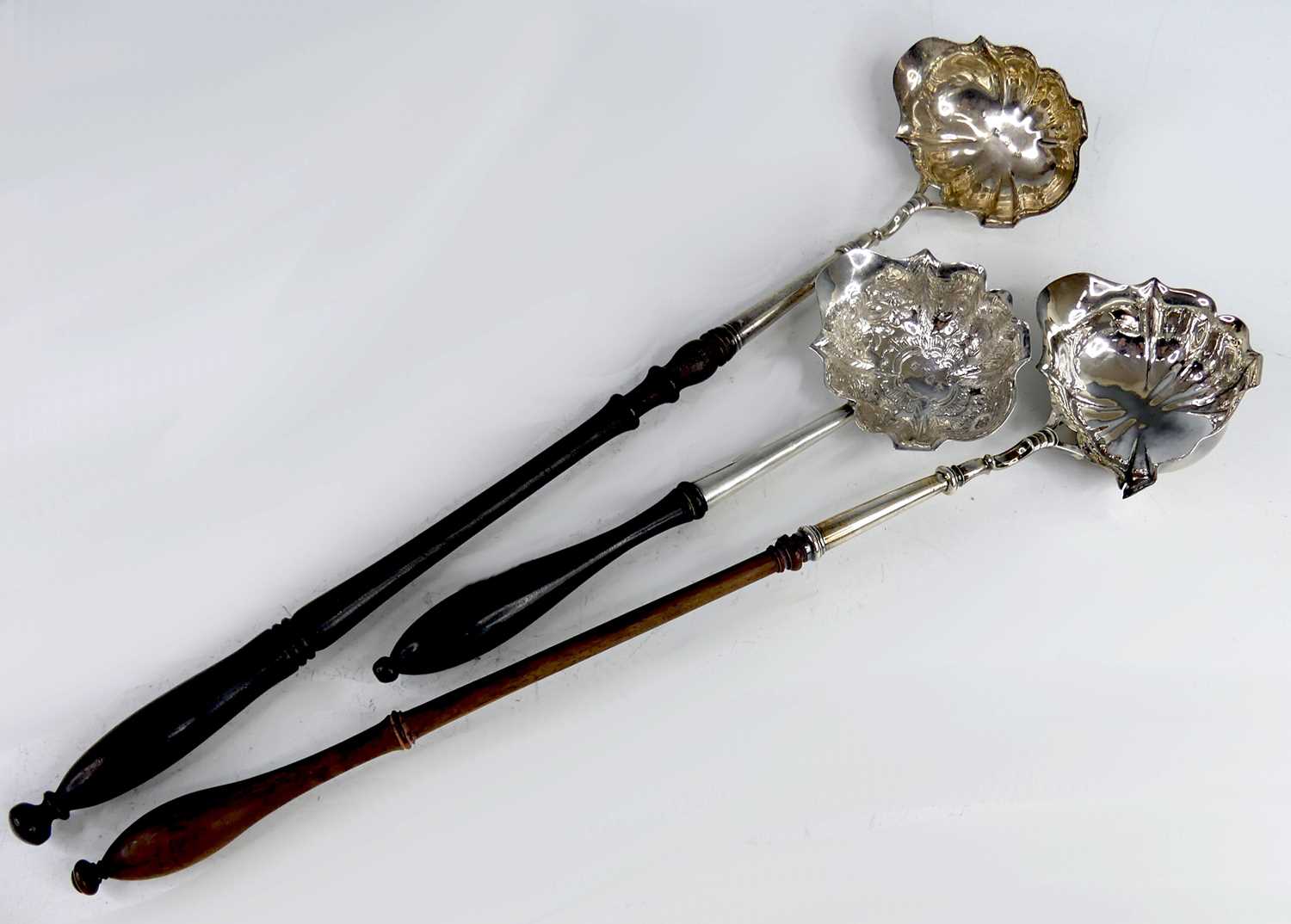 Lot 2075 - Three Georgian silver bowled and turned wooden...