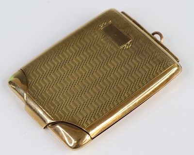 Lot 2705 - A 9ct yellow gold engine turned rectangular...