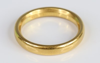 Lot 2708 - A 22ct gold 3.75mm court shaped wedding band,...