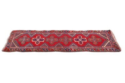 Lot 1137 - A hand knotted Persian style red ground runner,...