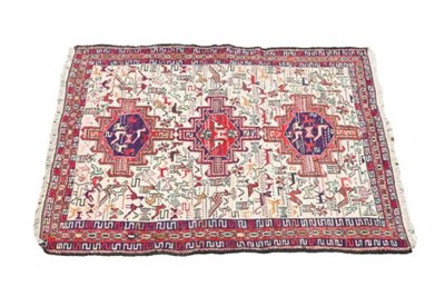 Lot 1135 - A Kilim rug, decorated with animals, within a...
