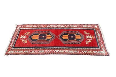 Lot 1140 - An Anatolian runner, with two lozenge-shaped...