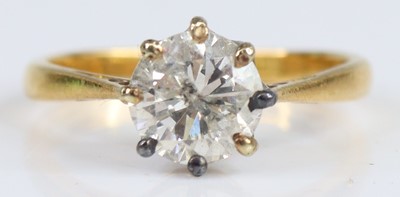 Lot 2716 - An 18ct gold diamond solitaire ring, featuring...