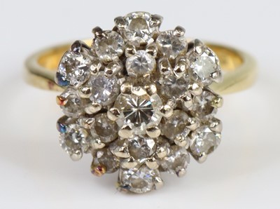 Lot 2718 - An 18ct gold diamond circular cluster ring,...