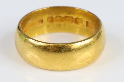 Lot 2719 - A 22ct 6.8mm D-shaped wedding band, size N,...