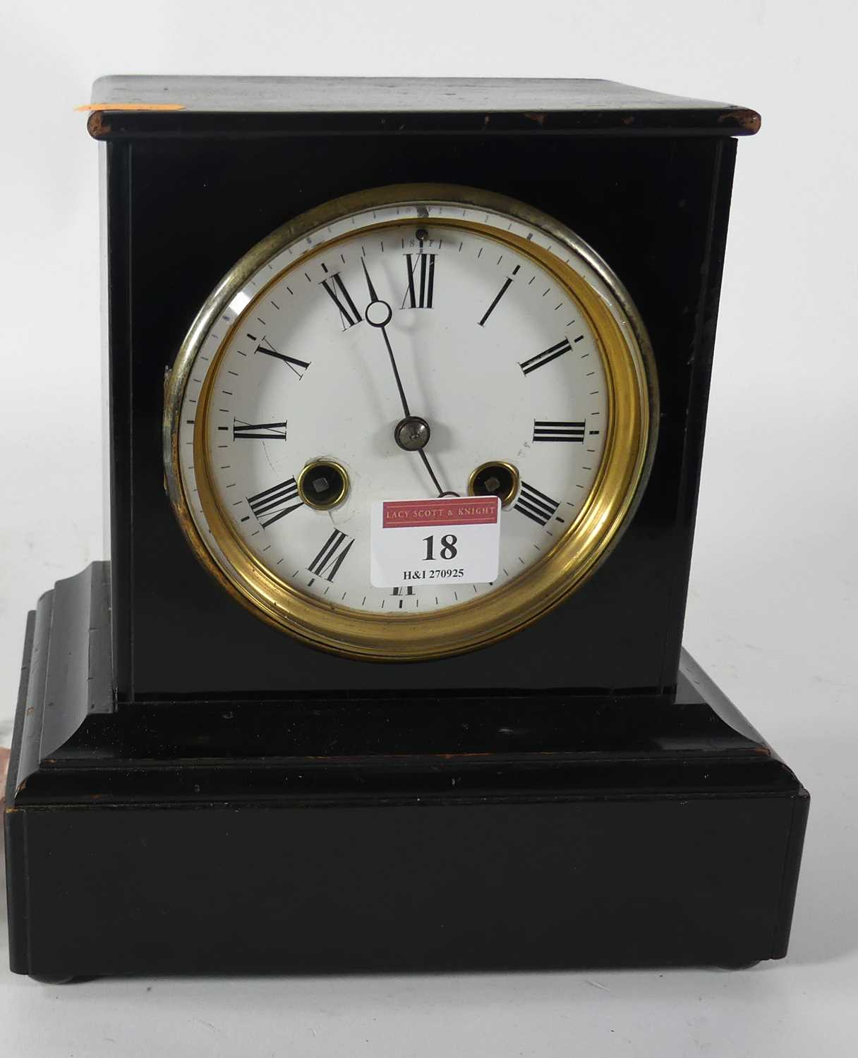 Lot 18 - A black lacquered mantel clock, having an...