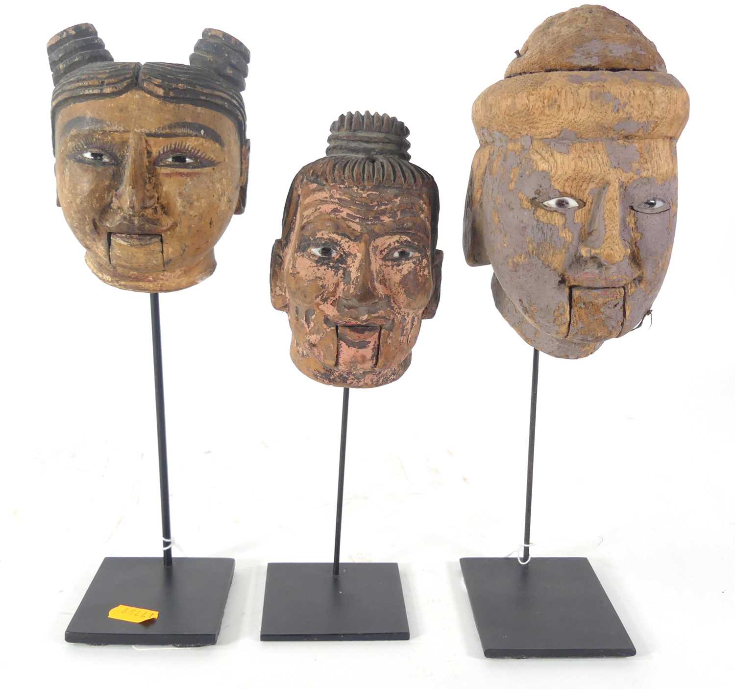 Lot 31 - A collection of mounted Burmese puppet heads,...