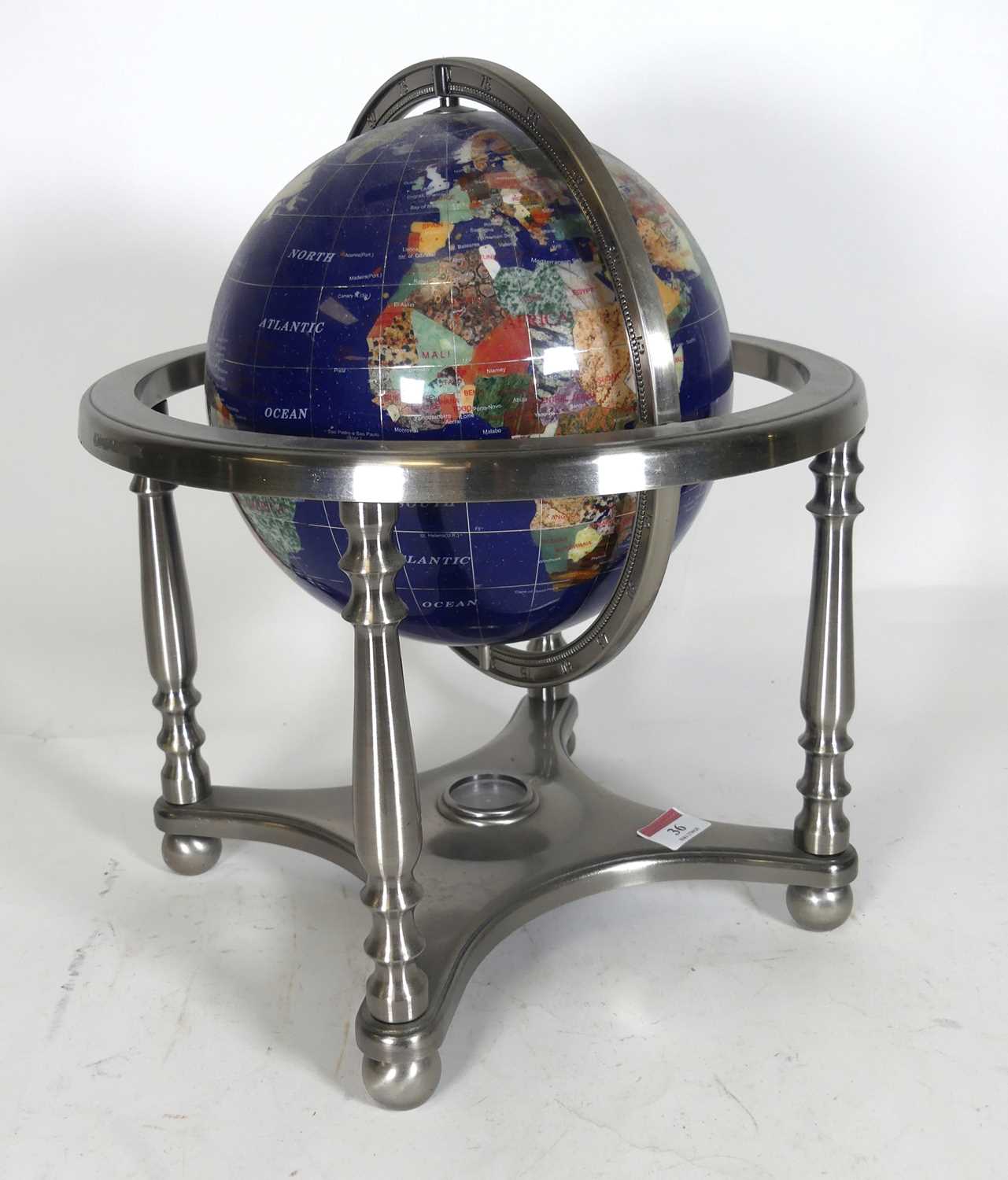 Lot 36 - A terrestrial table-top globe, having a...