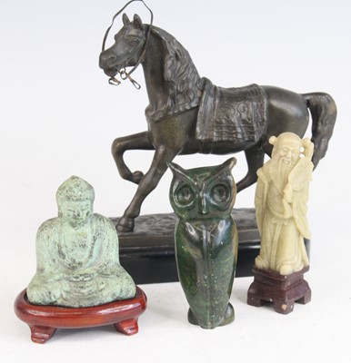 Lot 498 - A hollow cast verdigris model of a Buddha, in...