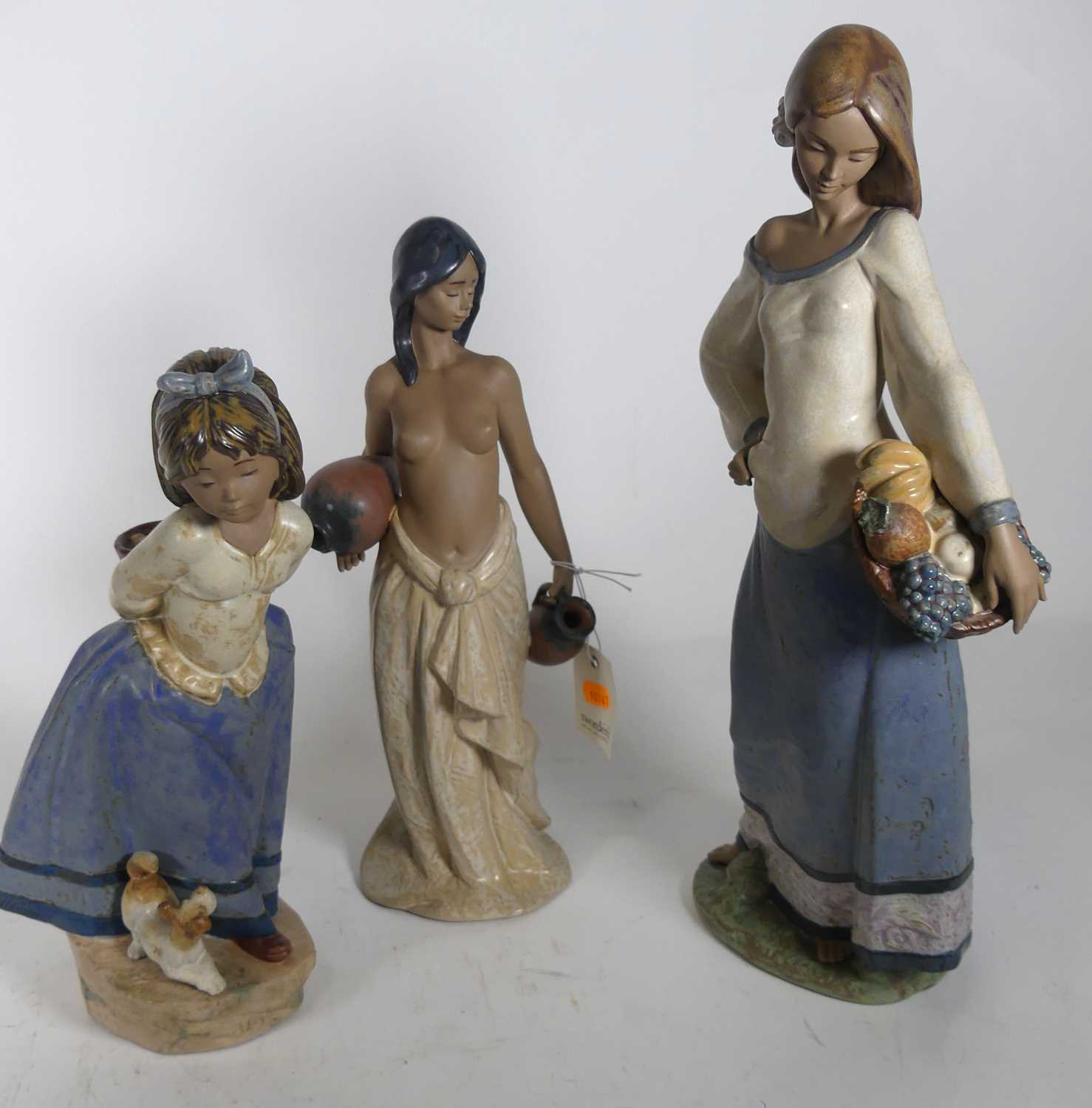 Lot 107 - A collection of Lladro figures, the largest...