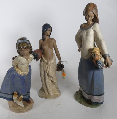 Lot 107 - A collection of Lladro figures, the largest...