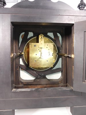 Lot 109 - An Aesthetic Movement ebonised mantel clock, h....