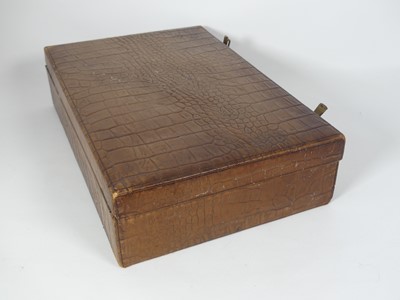 Lot 126 - A crocodile skin writing case, w.35cm