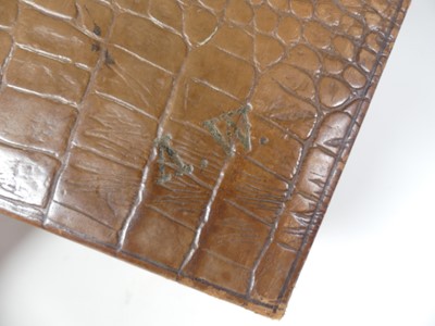 Lot 126 - A crocodile skin writing case, w.35cm