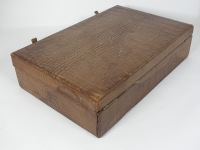 Lot 126 - A crocodile skin writing case, w.35cm