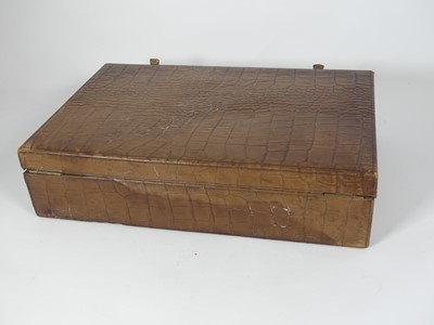 Lot 126 - A crocodile skin writing case, w.35cm