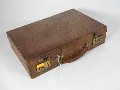 Lot 126 - A crocodile skin writing case, w.35cm
