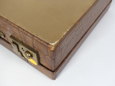Lot 126 - A crocodile skin writing case, w.35cm
