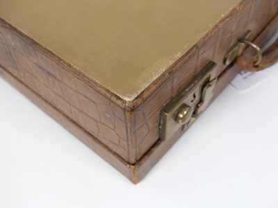 Lot 126 - A crocodile skin writing case, w.35cm