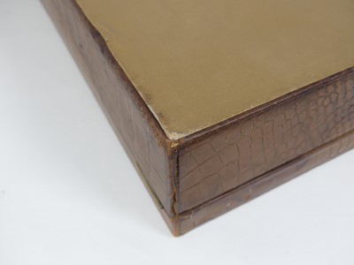 Lot 126 - A crocodile skin writing case, w.35cm