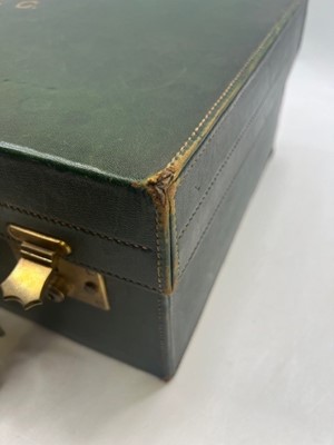Lot 111 - A green leather travel trunk marked Asprey...
