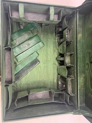 Lot 111 - A green leather travel trunk marked Asprey...