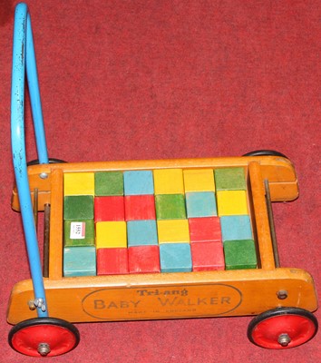 Lot 1552 - An original Triang wooden baby walker and...