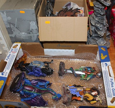 Lot 1556 - A collection of mythical resin figurines to...