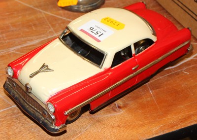 Lot 1576 - A Japanese tin plate and battery operated red...