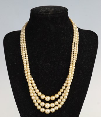 Lot 330 - A simulated pearl triple string choker, with...