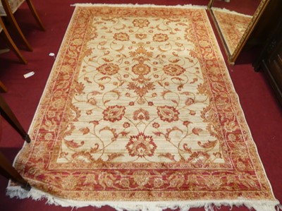 Lot 1125 - A contemporary machine made cream and red...