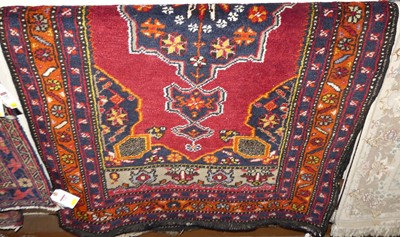 Lot 1127 - A Turkish woollen red and blue ground...
