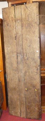 Lot 1161 - A long antique elm plank topped refectory...