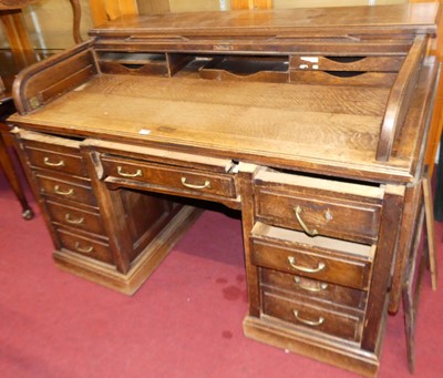 Lot 1163 - An early 20th century oak twin pedestal...