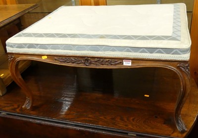 Lot 1164 - A circa 1900 French floral carved walnut...