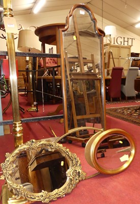 Lot 1172 - A walnut framed shaped arch topped wall mirror;...